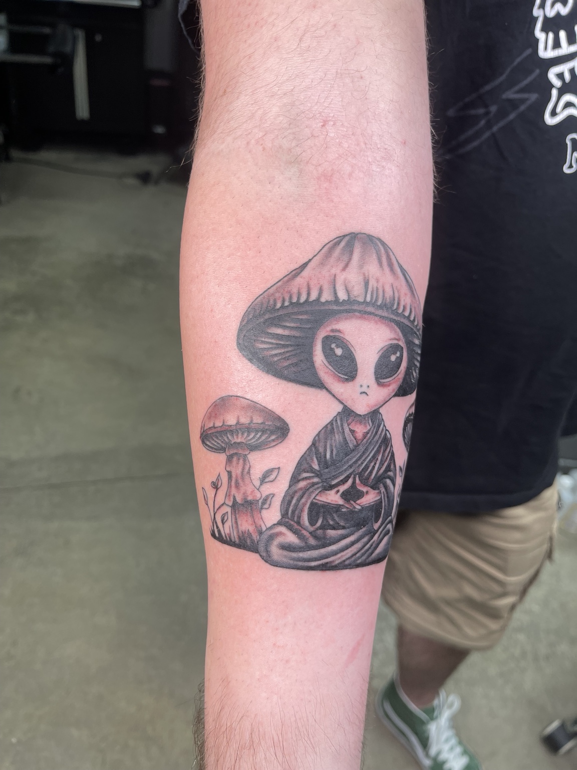 Mushroom character forearm tattoo primary view