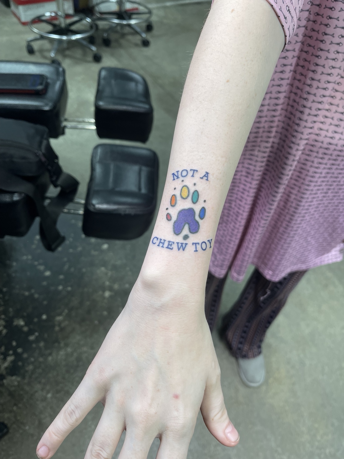 Pet themed paw tattoo with text