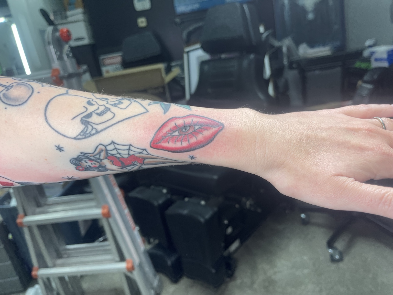 Color eye and lips forearm tattoo, alternate view