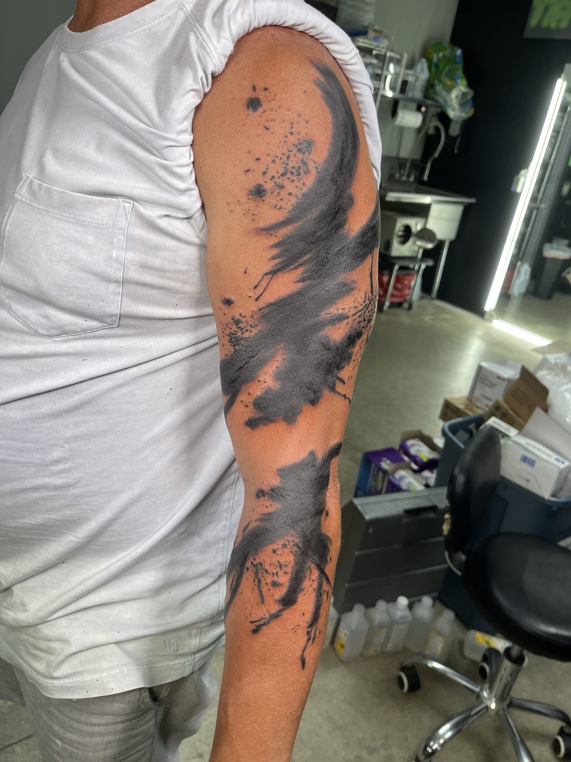 Abstract brushwork arm tattoo alternate view