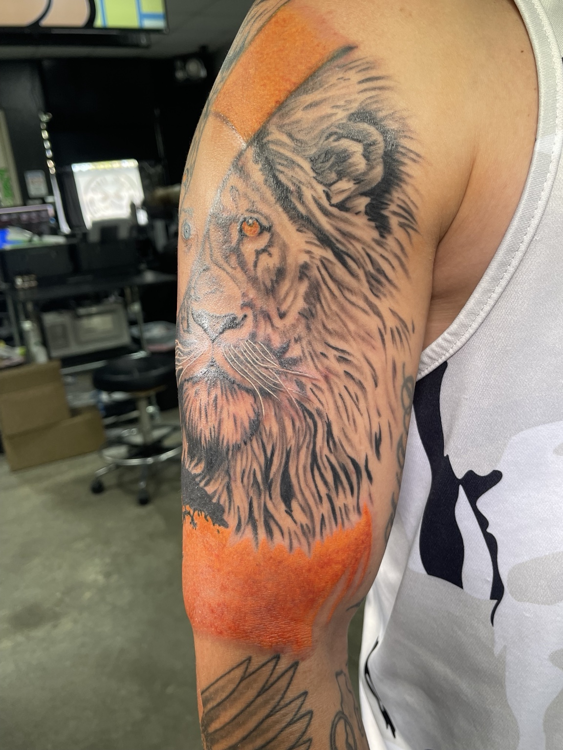 Lion upper arm tattoo alternate view