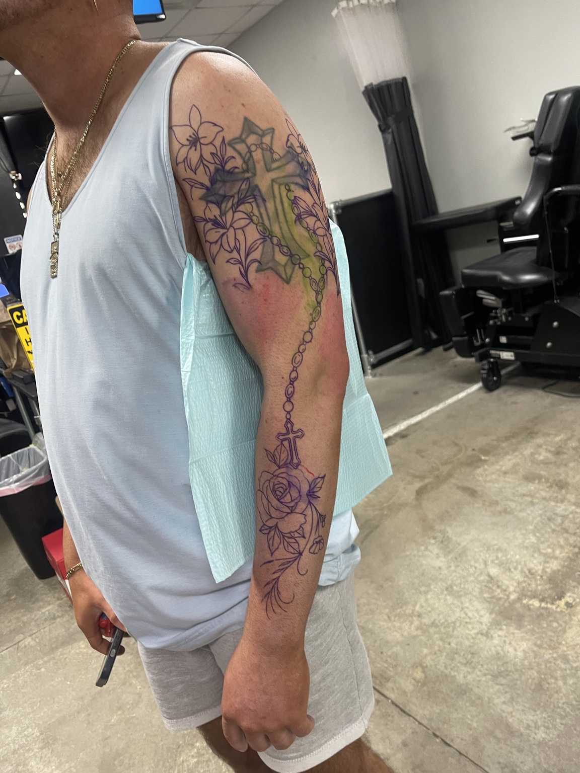 Large black and grey upper arm tattoo