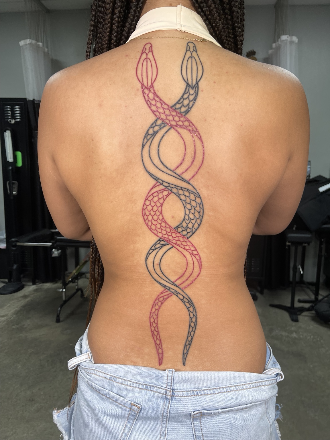 Large symmetrical spine tattoo