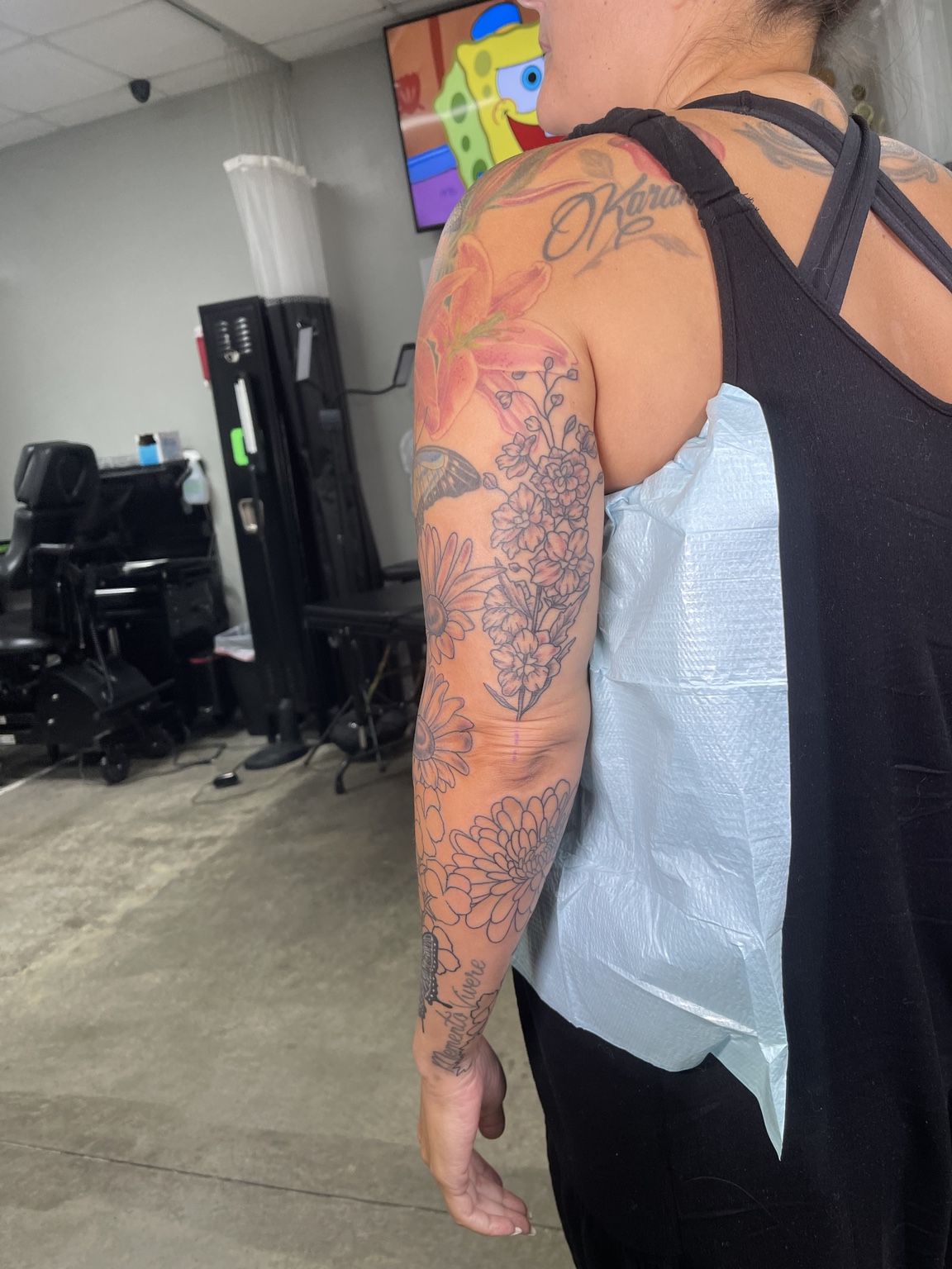 Floral arm tattoo primary view