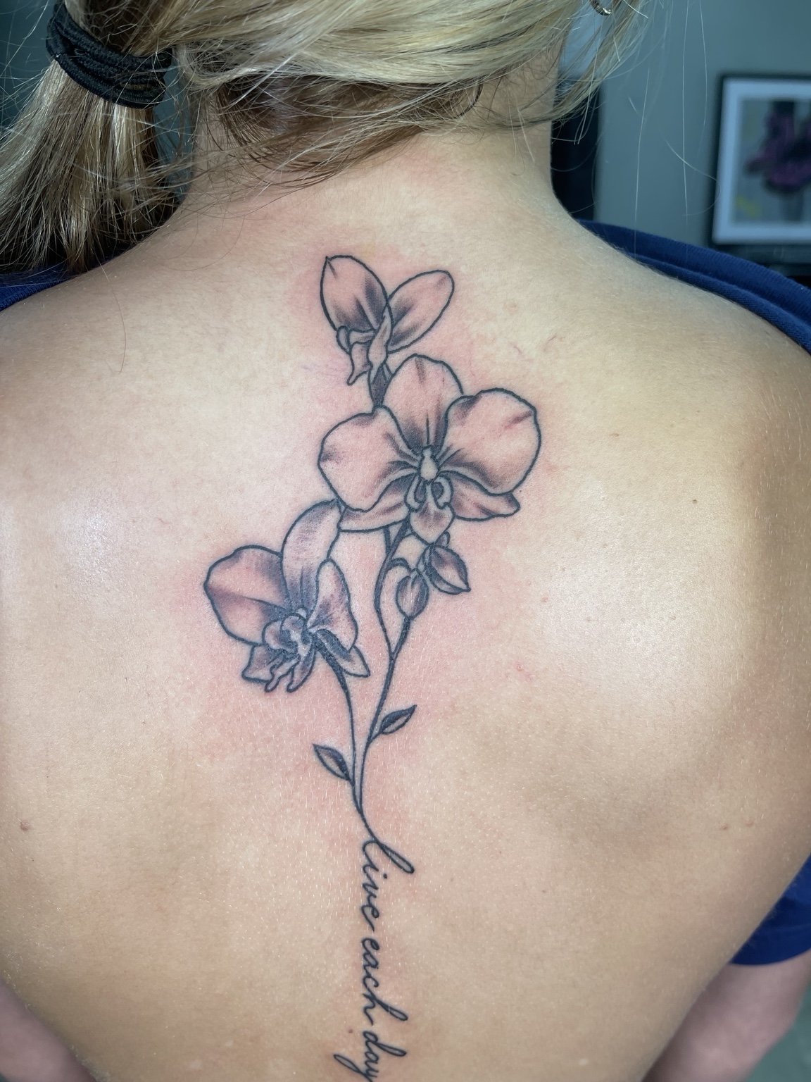 Floral spine tattoo detail view