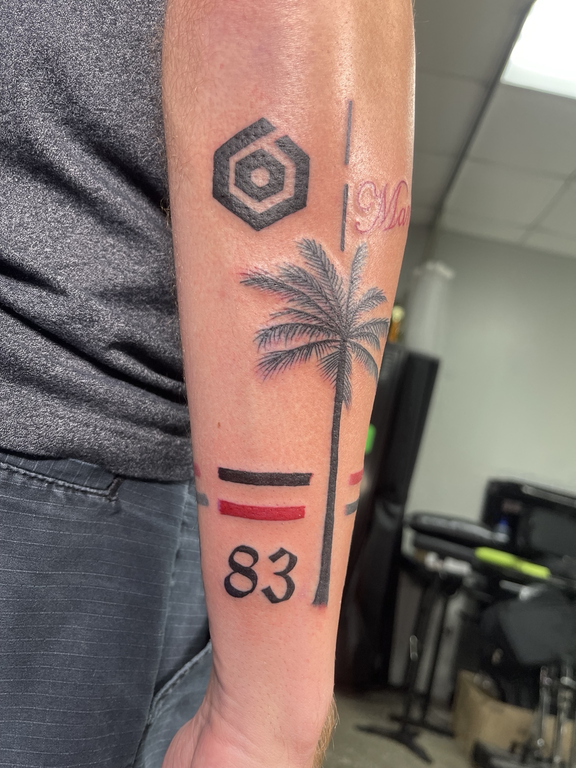 Palm tree arm tattoo second view