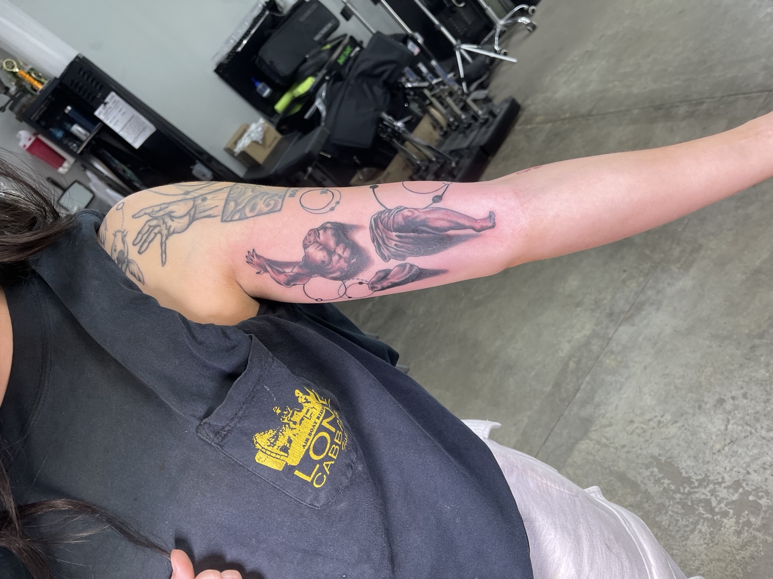 Pink character forearm tattoo