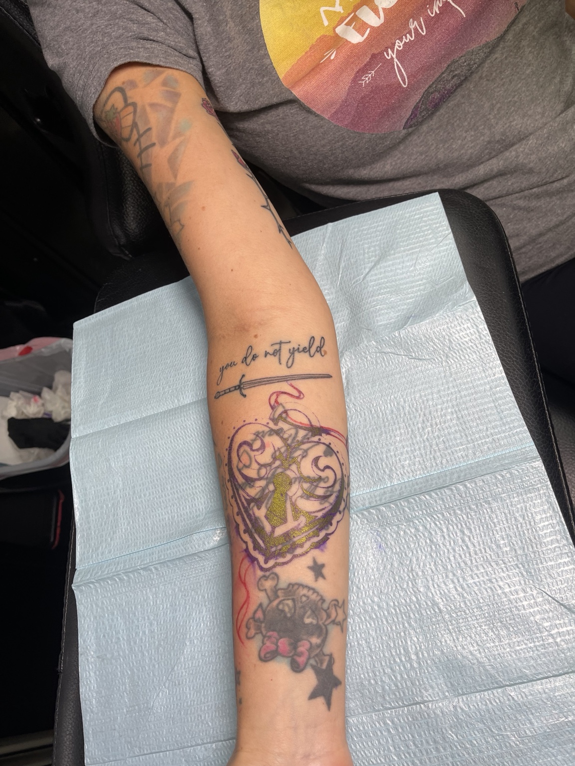 Heart forearm tattoo earlier view