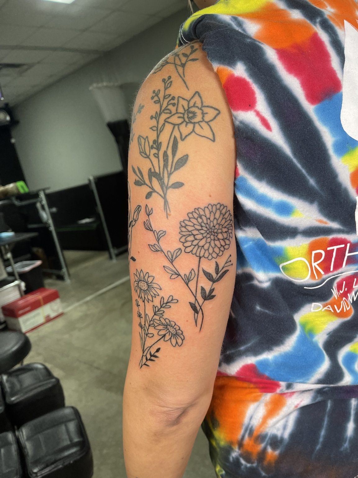 Floral upper arm tattoo primary view