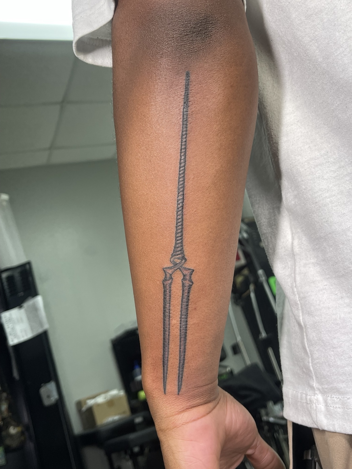 Long sword forearm tattoo