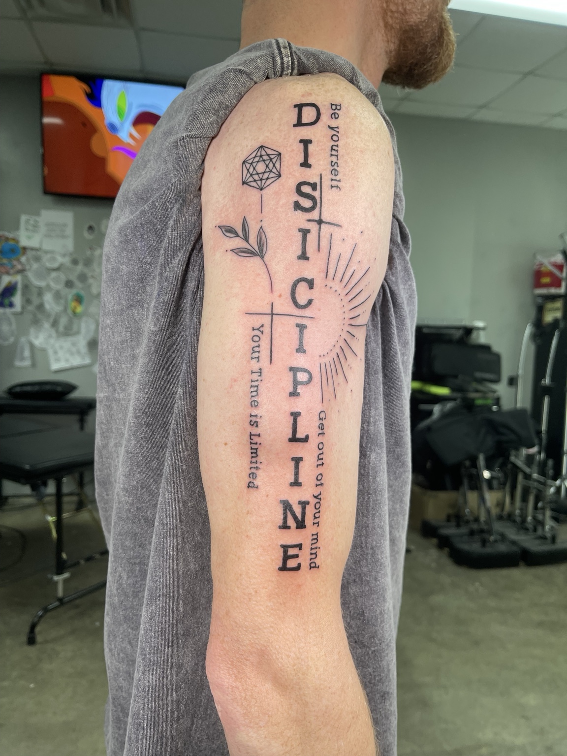 Vertical discipline lettering tattoo alternate view