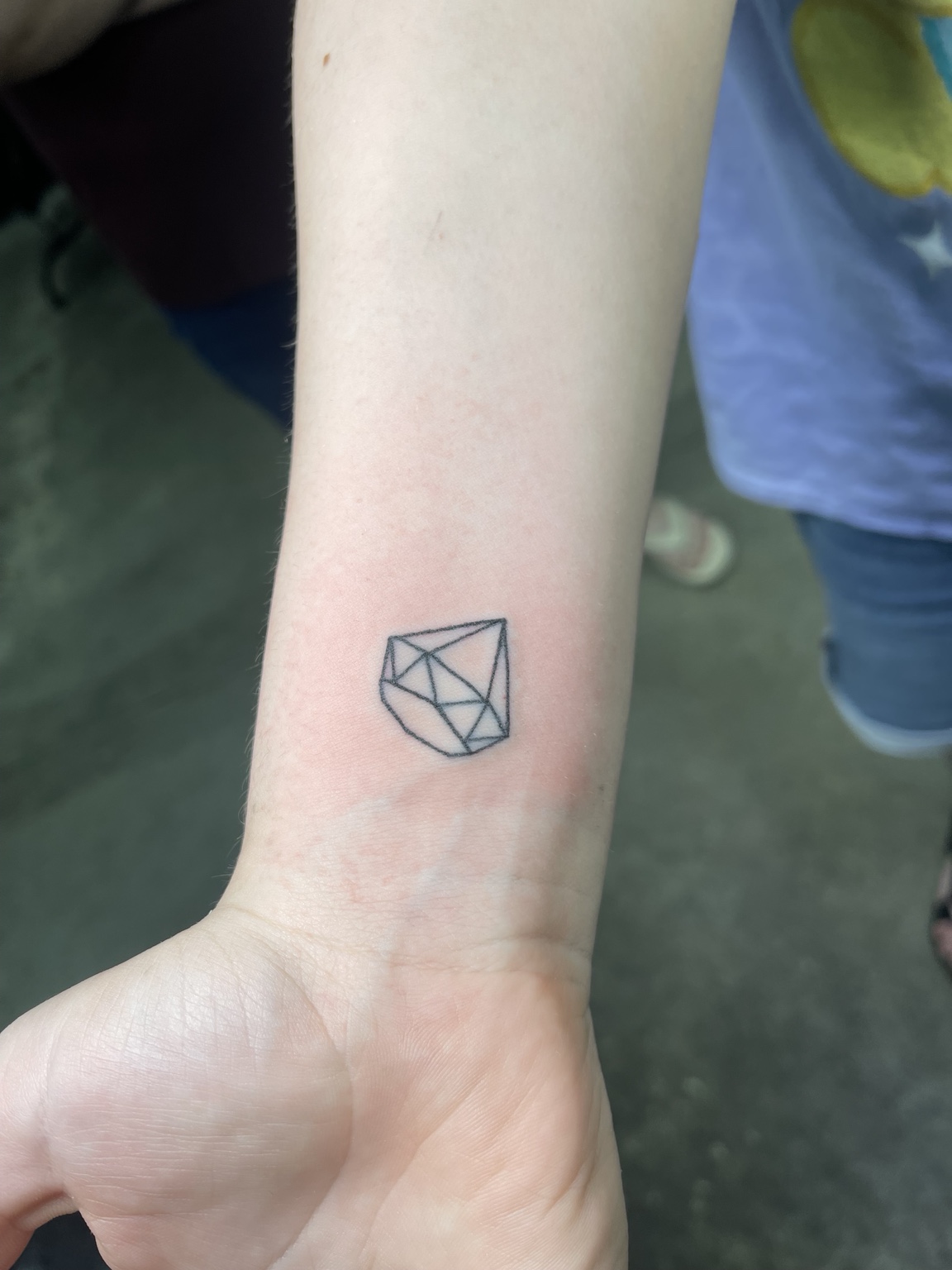 Small outlined diamond tattoo