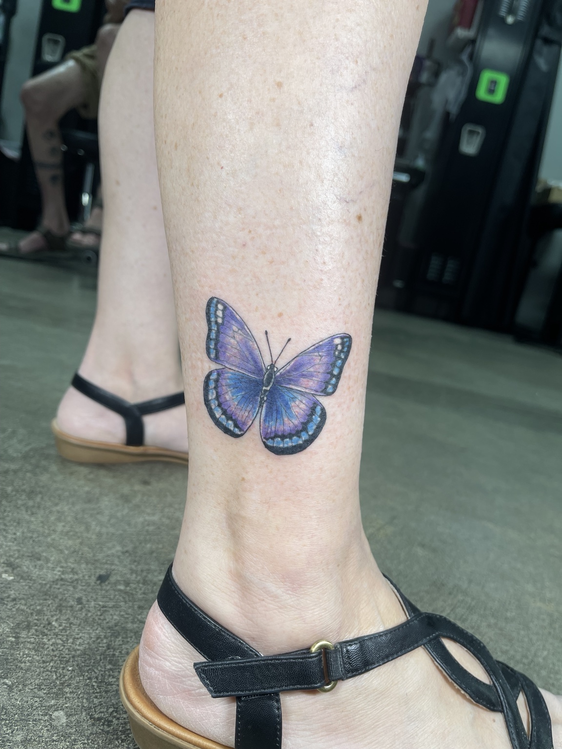 Small color butterfly ankle tattoo