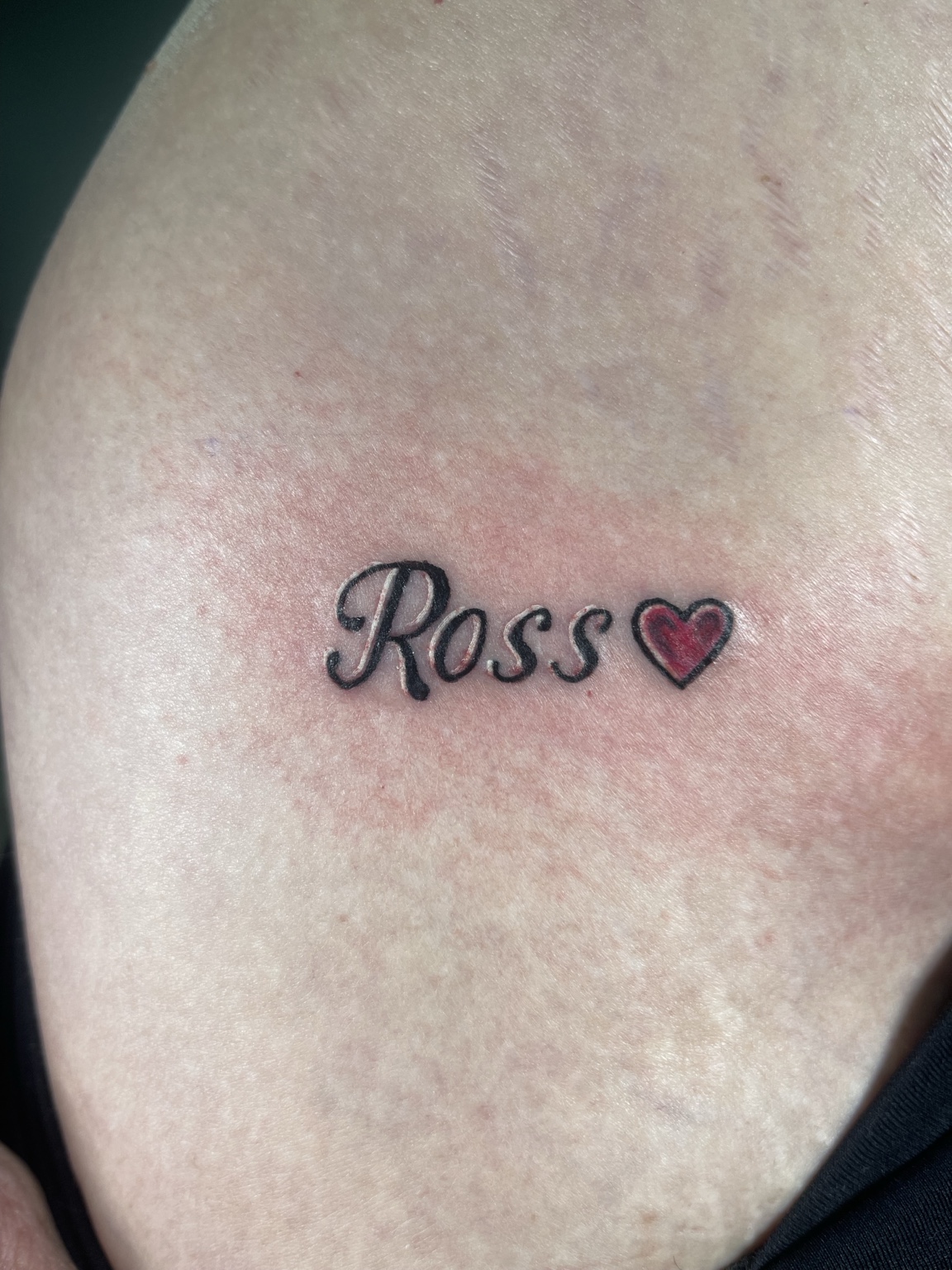 Small script tattoo with heart