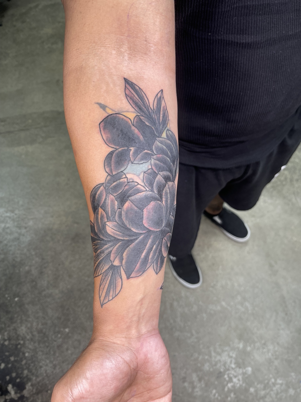 Developed black and grey floral forearm tattoo