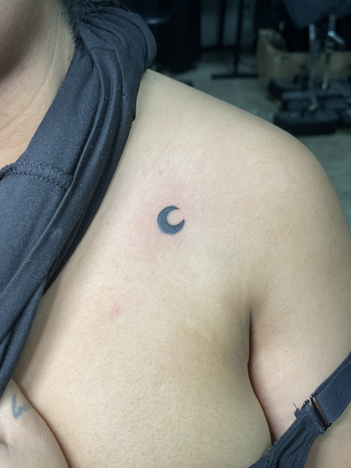 Small crescent moon tattoo