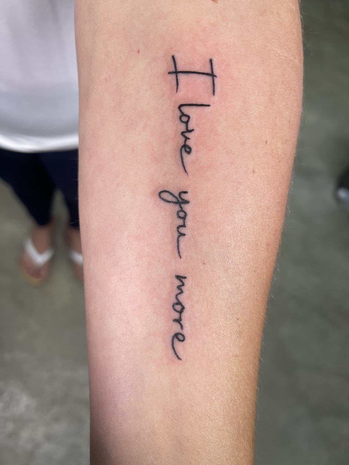 Forearm script tattoo